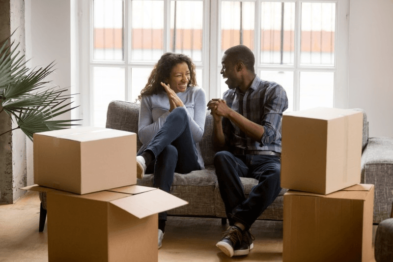 A young couple ready to move to a new place.