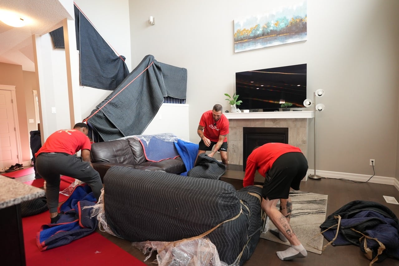 Wetaskiwin Movers carefully disassembling large furniture for moving